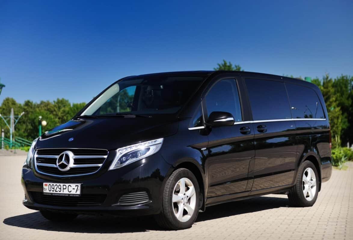 Mercedes-Benz luxury van for airport transfers and corporate transportation services.