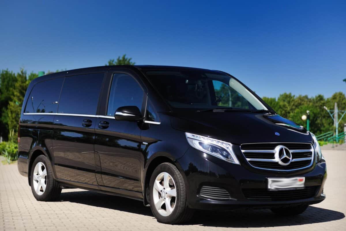 Black Mercedes-Benz van for airport to CBD transfer in Australia.